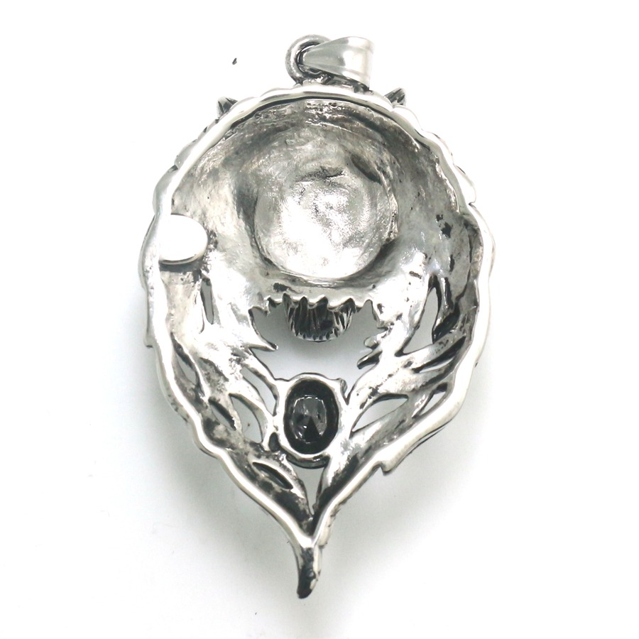 Back hollow structure of gothic wolf head pendant showing chain attachment bail and interior craftsmanship