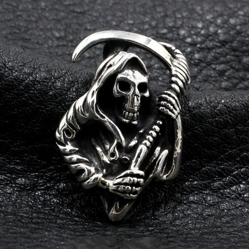 Grim Reaper gothic skeleton pendant on black leather background, front view highlighting polished retro metal grim reaper pattern