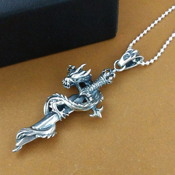 Gothic dragon sword necklace on chain - right oblique view with oxidized vintage silver finish and black jewelry box