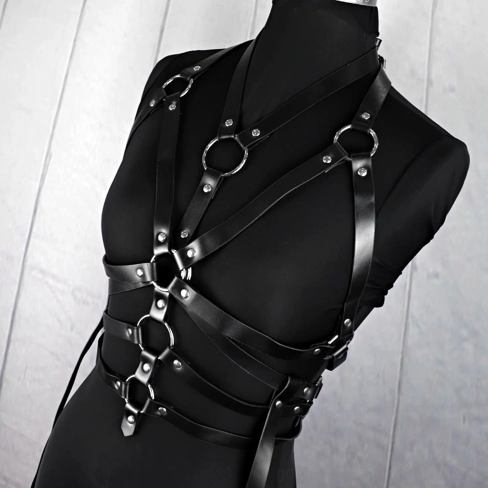 Adjustable bondage harness belt demonstrating strap customization and metal buckle mechanism for personalized fit
