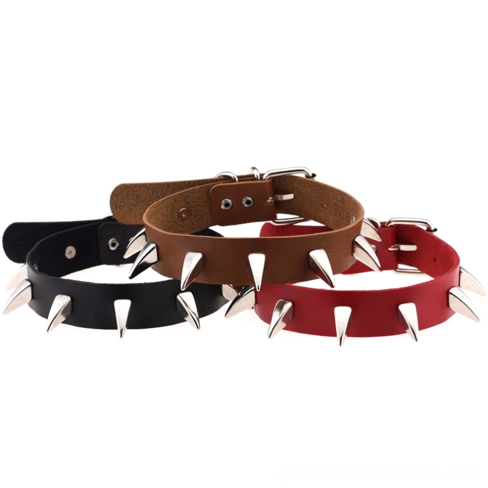 Gothic spiked leather choker necklaces laid out in black, brown and red color options with adjustable buckle