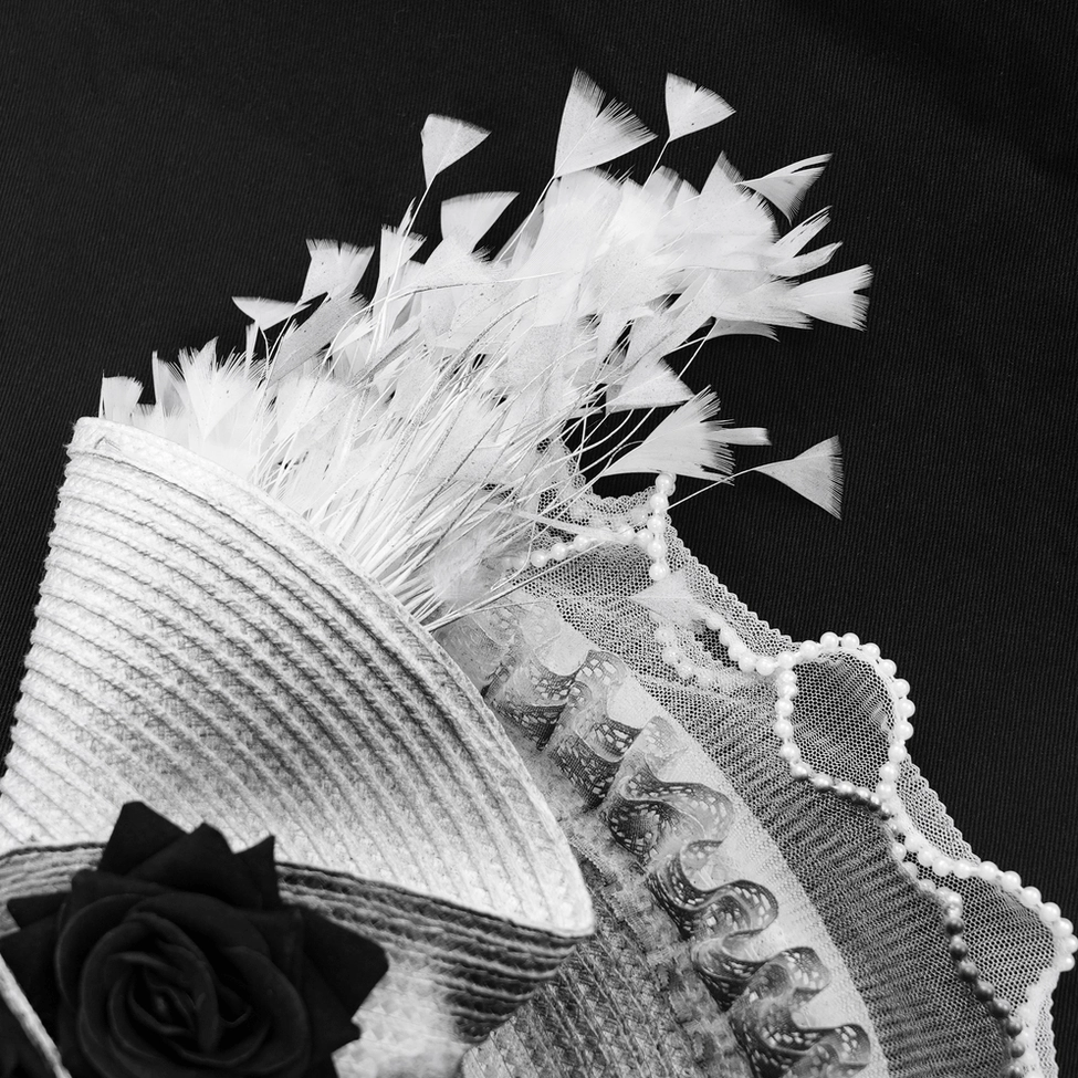 Alternative fashion fascinator hat showcasing intricate black lace work and refined dark romantic aesthetic