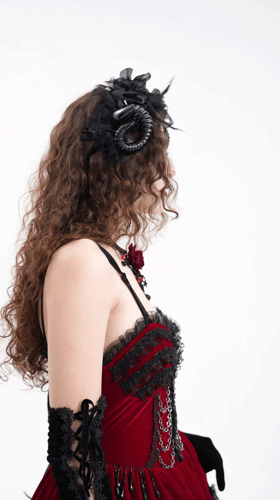 Alternative fashion gothic horn headpiece with ruffled accents and dramatic spiral horns, artistic presentation