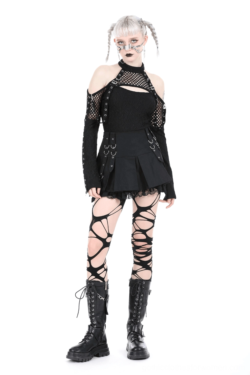 Alternative fashion black mini skirt detail view showing pleated construction, metal hardware, and gothic style elements