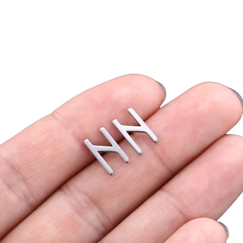 Alternative gothic rune stud earring, silver-toned stainless steel with hollow geometric rune symbol