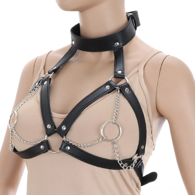 Three-quarter view of black leather chest harness on mannequin, silver hardware details visible