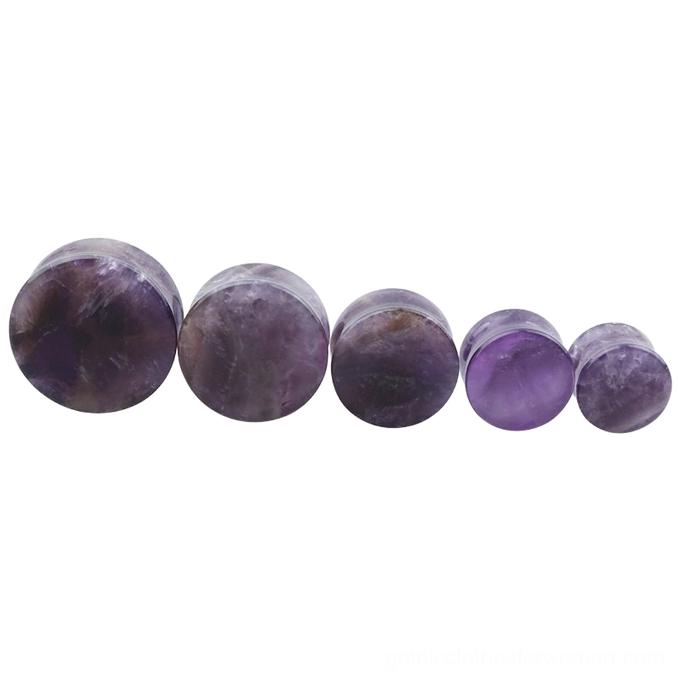 Amethyst flesh tunnel gauges set displayed overhead showing complete size progression, natural stone variations, and quality craftsmanship for alternative gothic aesthetic