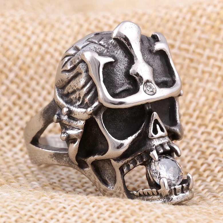 Anarchy skull ring crystal accent close-up on burlap texture, dark gothic aesthetic