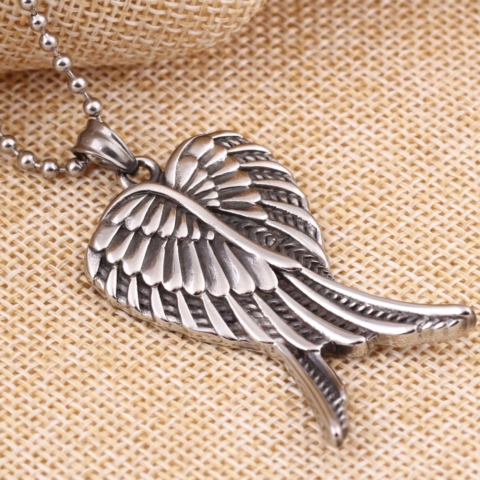 Stainless Steel Angel Wings Pendant - Side Three-Quarter View Highlighting Realistic Carved Feather Details and Depth
