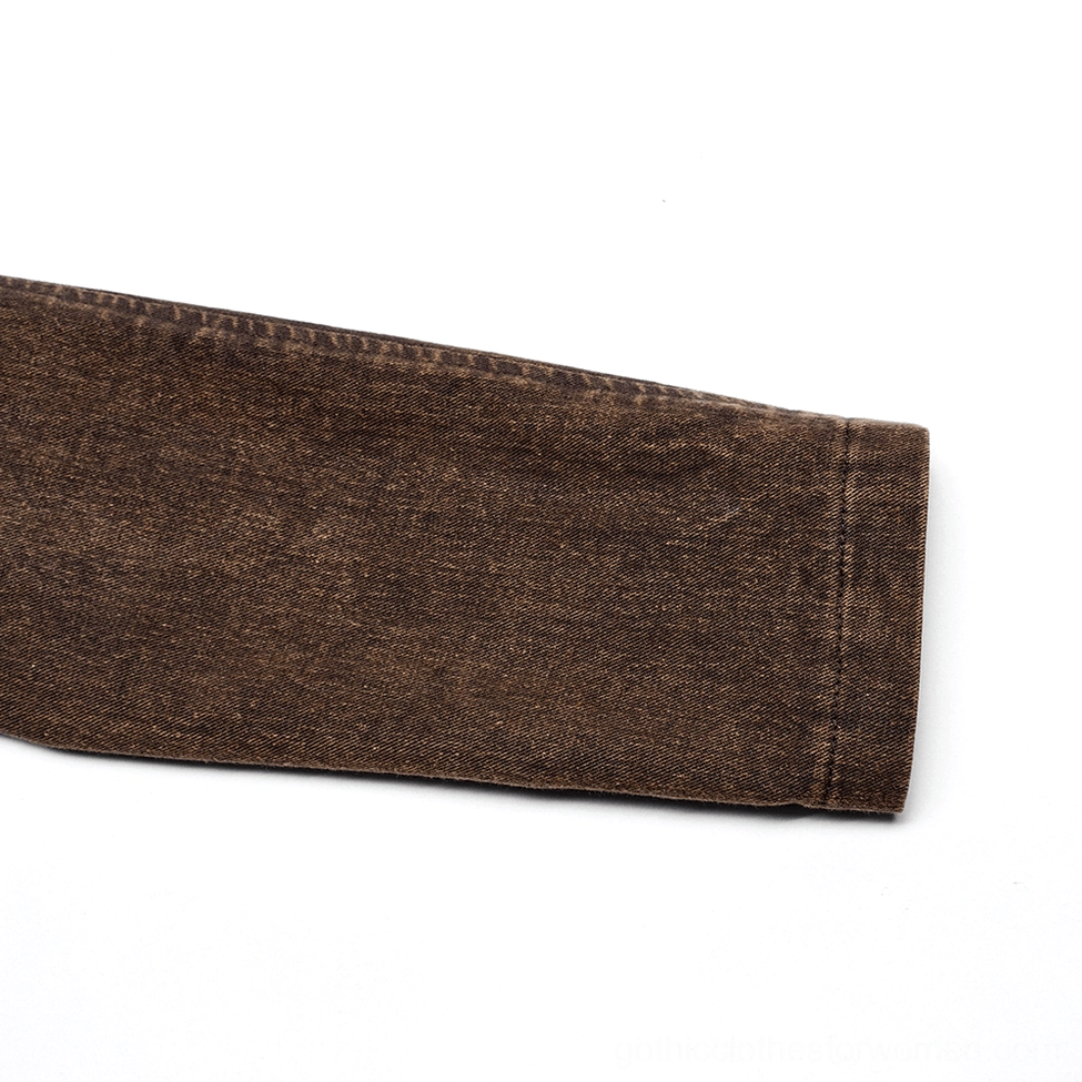 Detail shot of brown washed denim-style jacket sleeve fabric with straight cuff finish