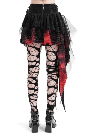 Black gothic asymmetrical skirt back view showing back zipper closure, worn with fishnet tights and platform heels