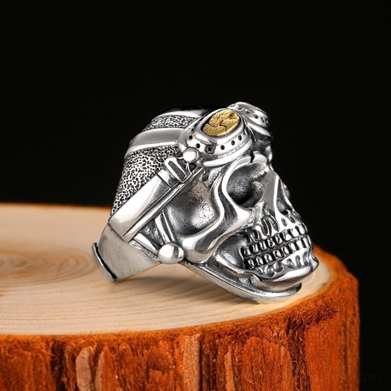Right side profile view of aviator skull gothic ring displaying textured goggle strap details and dimensional carving