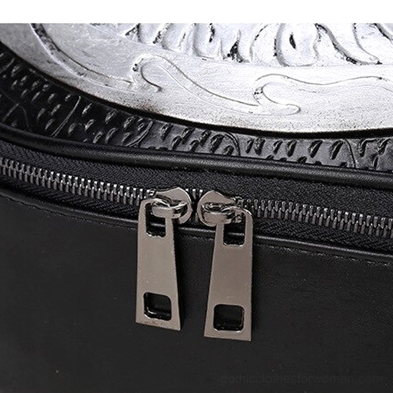 Dual metal zipper pulls and embossed leather surface of gothic backpack showing craftsmanship