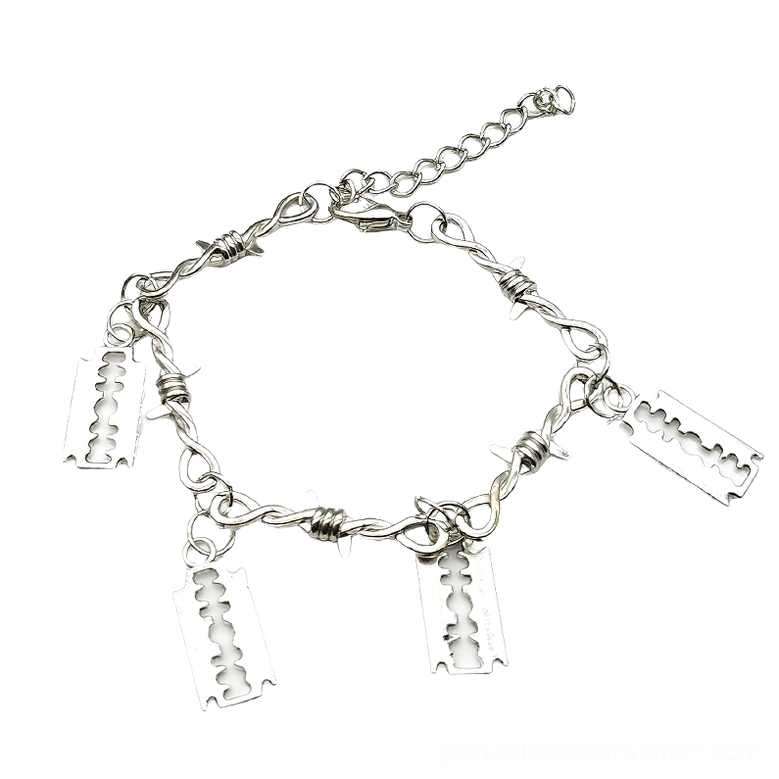 Barbed wire gothic bracelet flat lay top-down view showing four blade charms and adjustable extension chain in silver zinc alloy