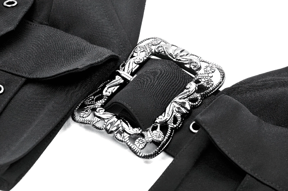 Macro close-up of black harness crop top's ornate silver baroque square buckle with engraved details and black fabric texture