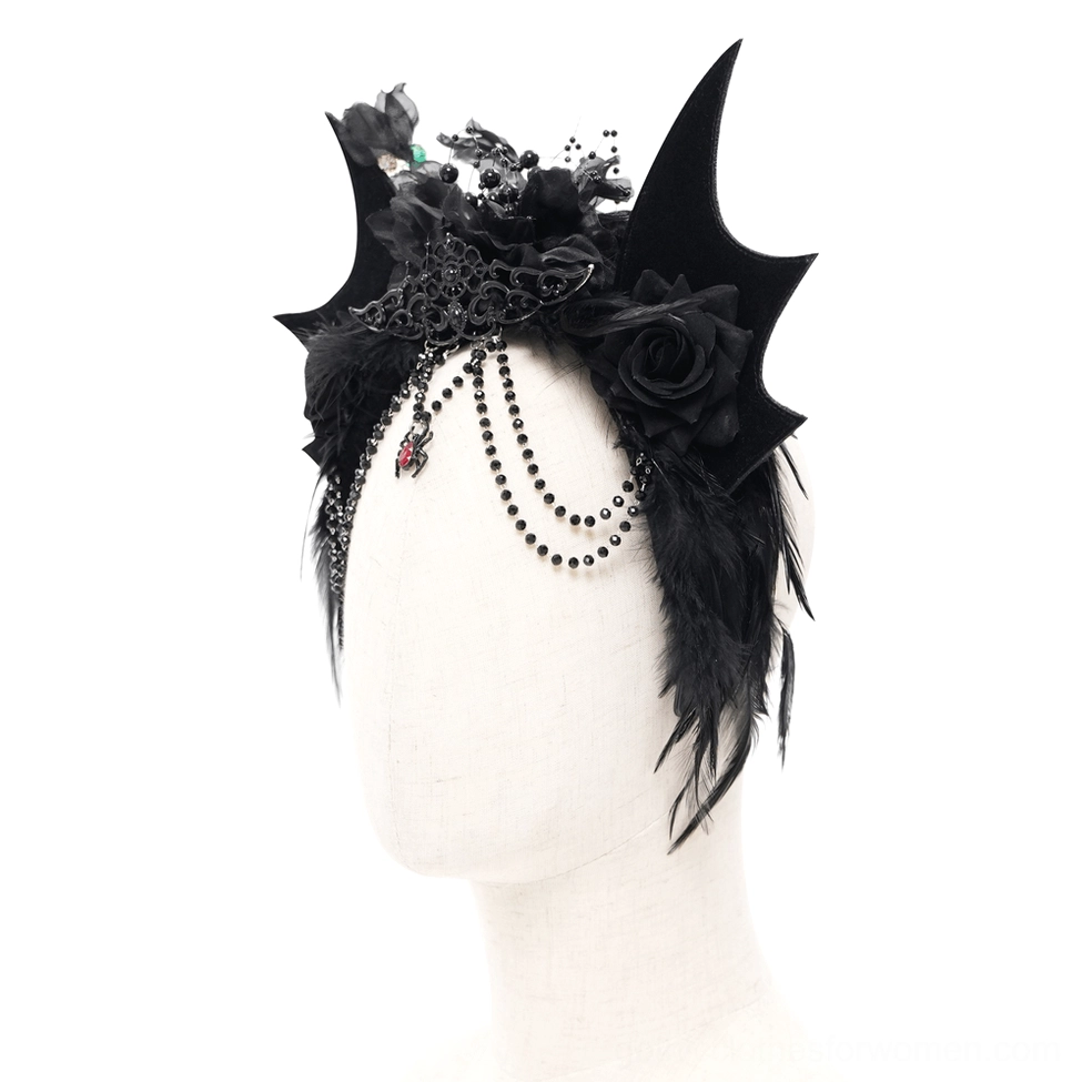 Close-up front detail of black bat crown showing intricate bead tassel, metal filigree, and gem accents