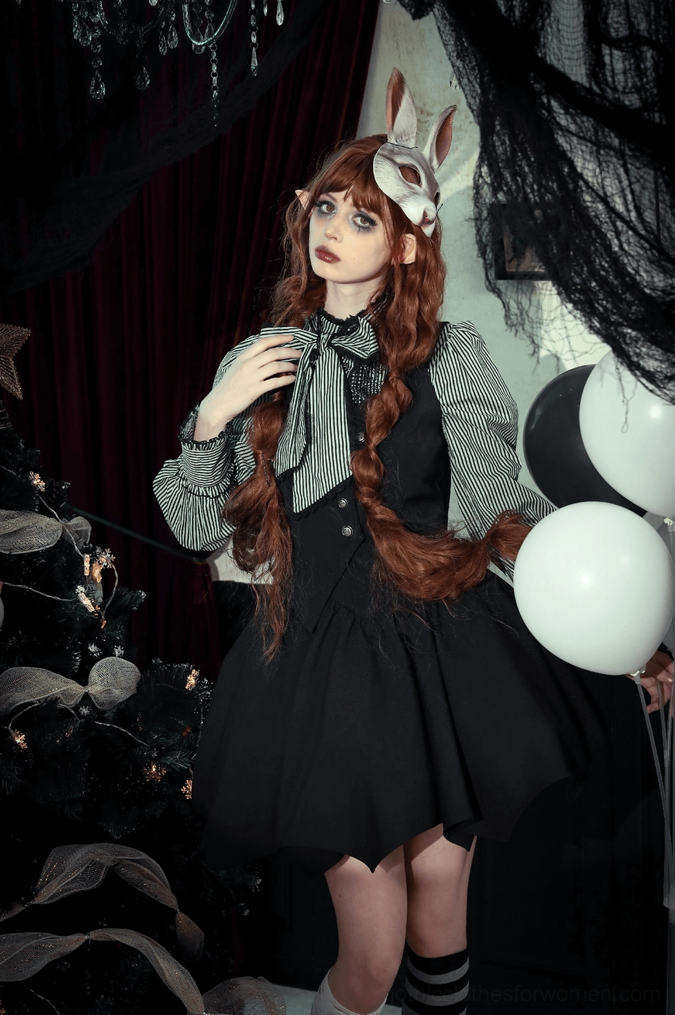 Black bat wing corset top back angle showing full lace-up construction and adjustable strap placement