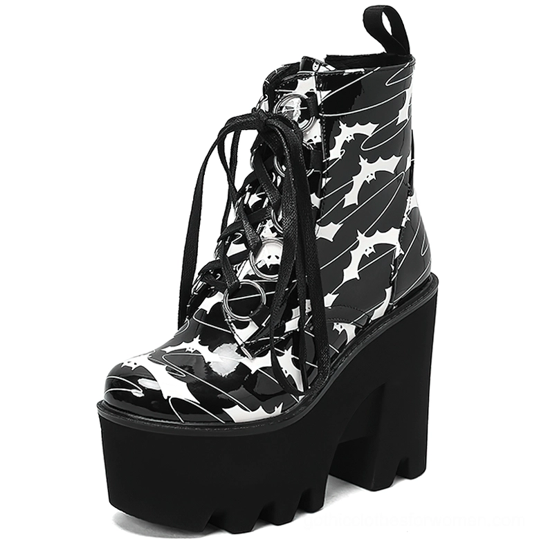 Gothic platform ankle boots front three-quarter view showing lace-up closure, collar pull tab, round toe silhouette, and black chunky heel