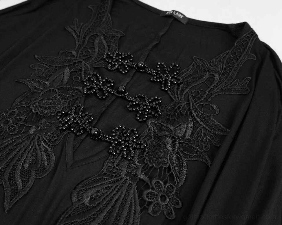Detailed close-up of beaded chest lace applique on gothic mermaid dress, featuring cross motif and floral embroidery with decorative beading