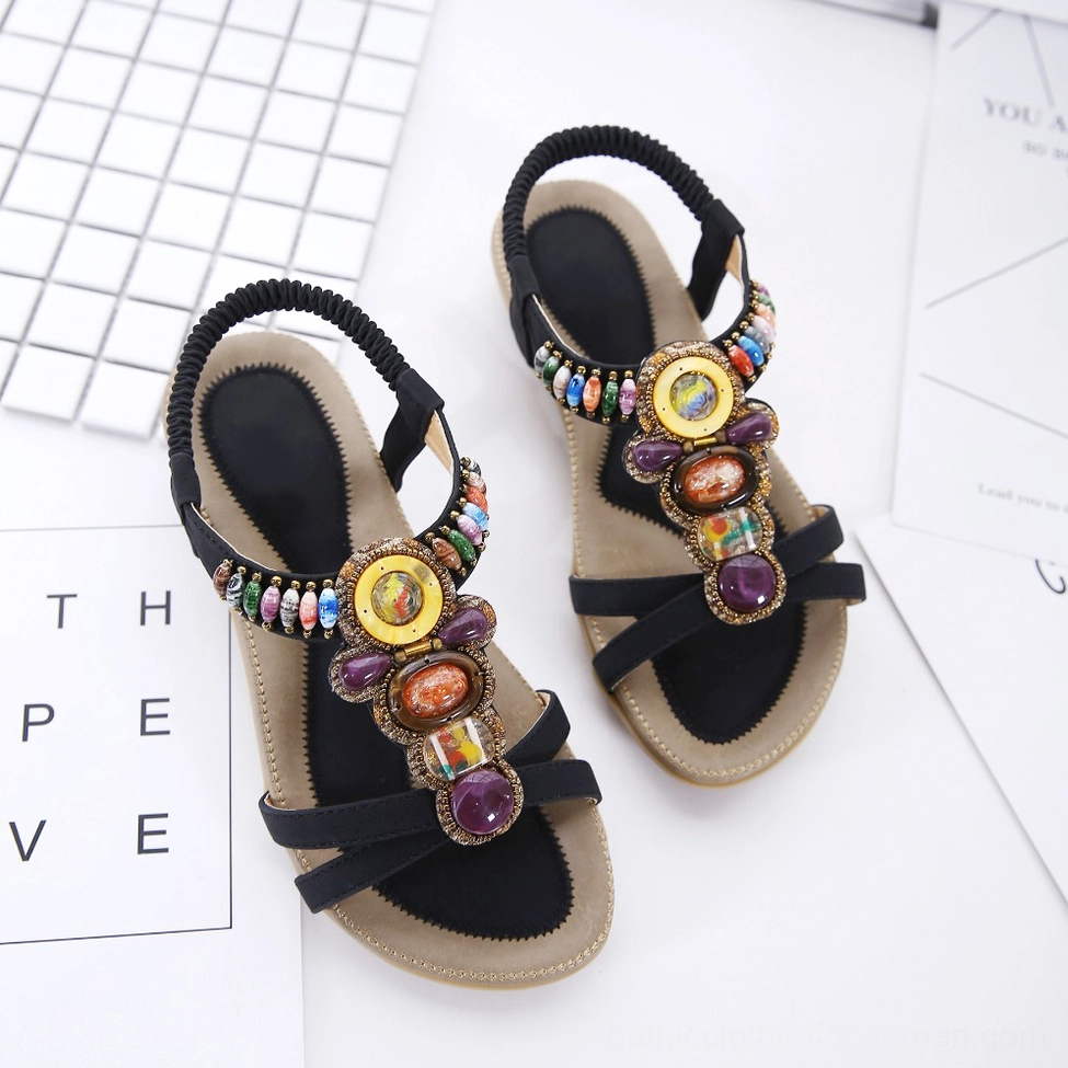 Beaded gothic sandal showing open toe design, colorful gemstone embellishment, and flat sole profile