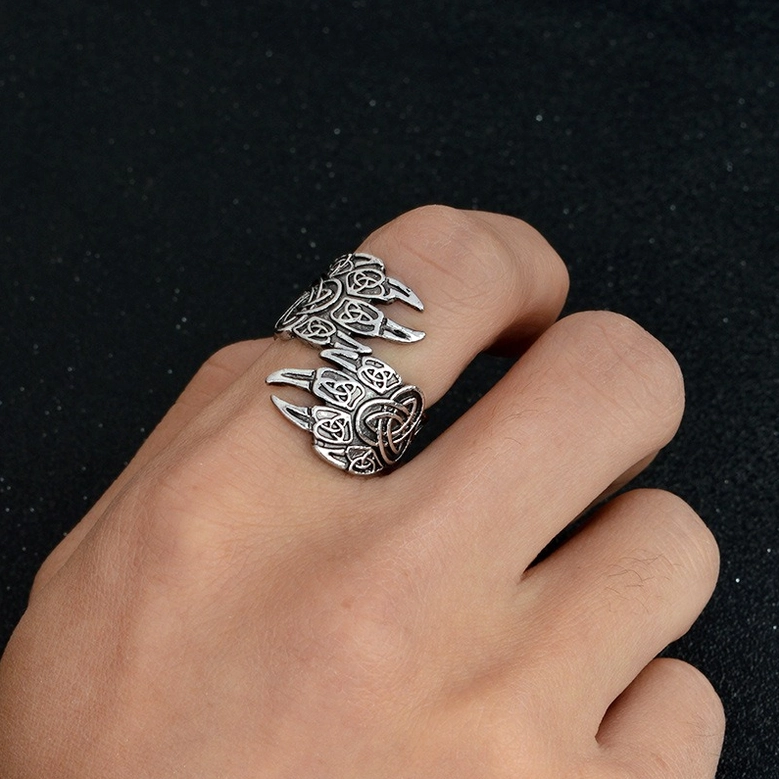 Nordic bear claw ring on human hand, vintage worn silver finish, gothic jewelry worn