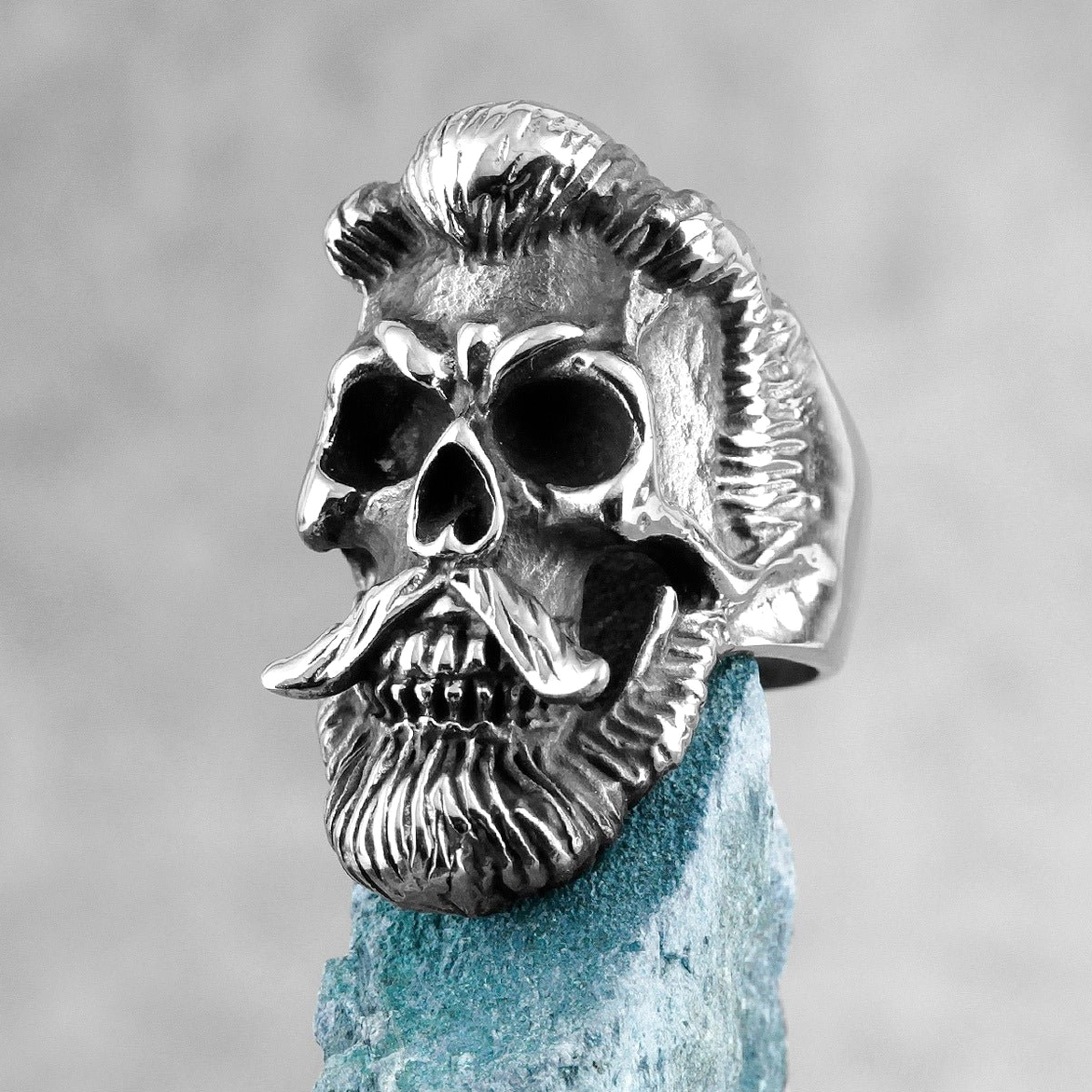 Bearded gentleman gothic skull ring in vintage silver metal with detailed carved skull texture on stone block
