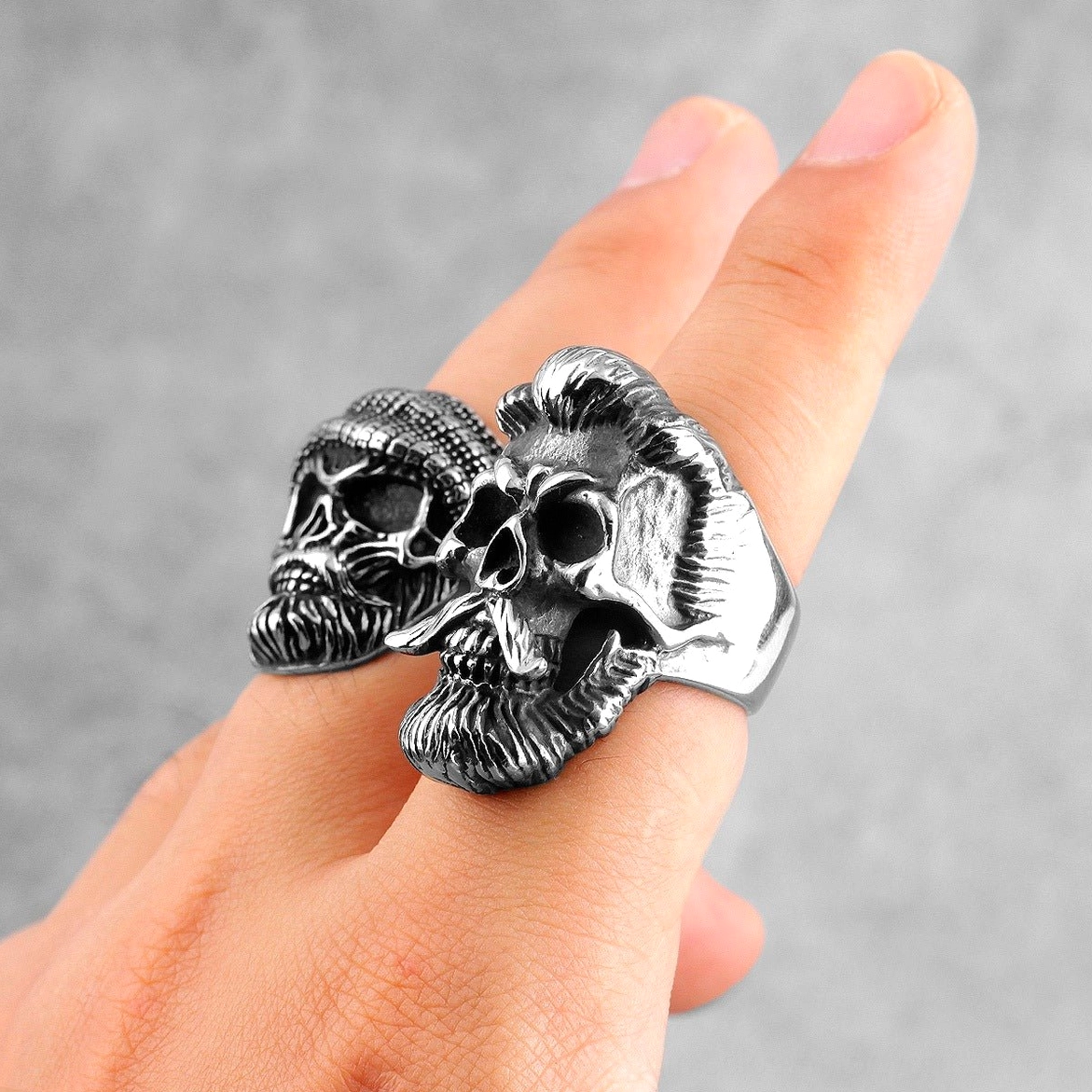 Paired bearded gentleman gothic skull rings in vintage silver stainless steel shown in side close-up view