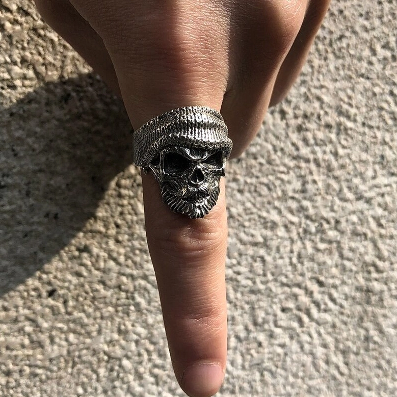 Bearded skull sterling silver gothic ring lifestyle detail shot showcasing intricate hand-carved facial features and vintage antiqued patina finish