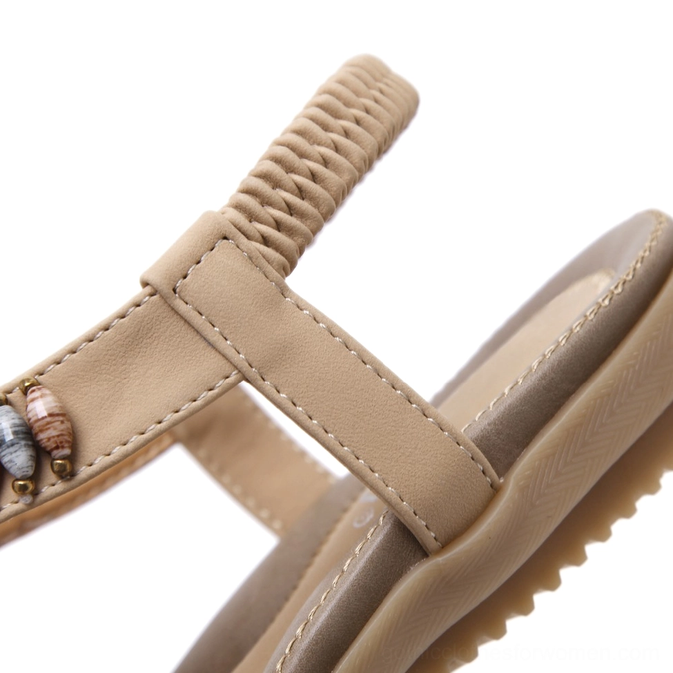 Beige beaded gothic sandal showing overall design with open toe, colorful gemstone bead work, and ankle strap