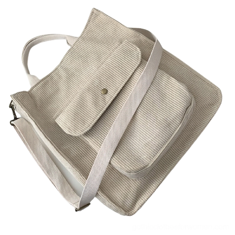 Beige corduroy gothic tote crossbody bag with wide adjustable strap, elevated angled view showing soft neutral dark academia style