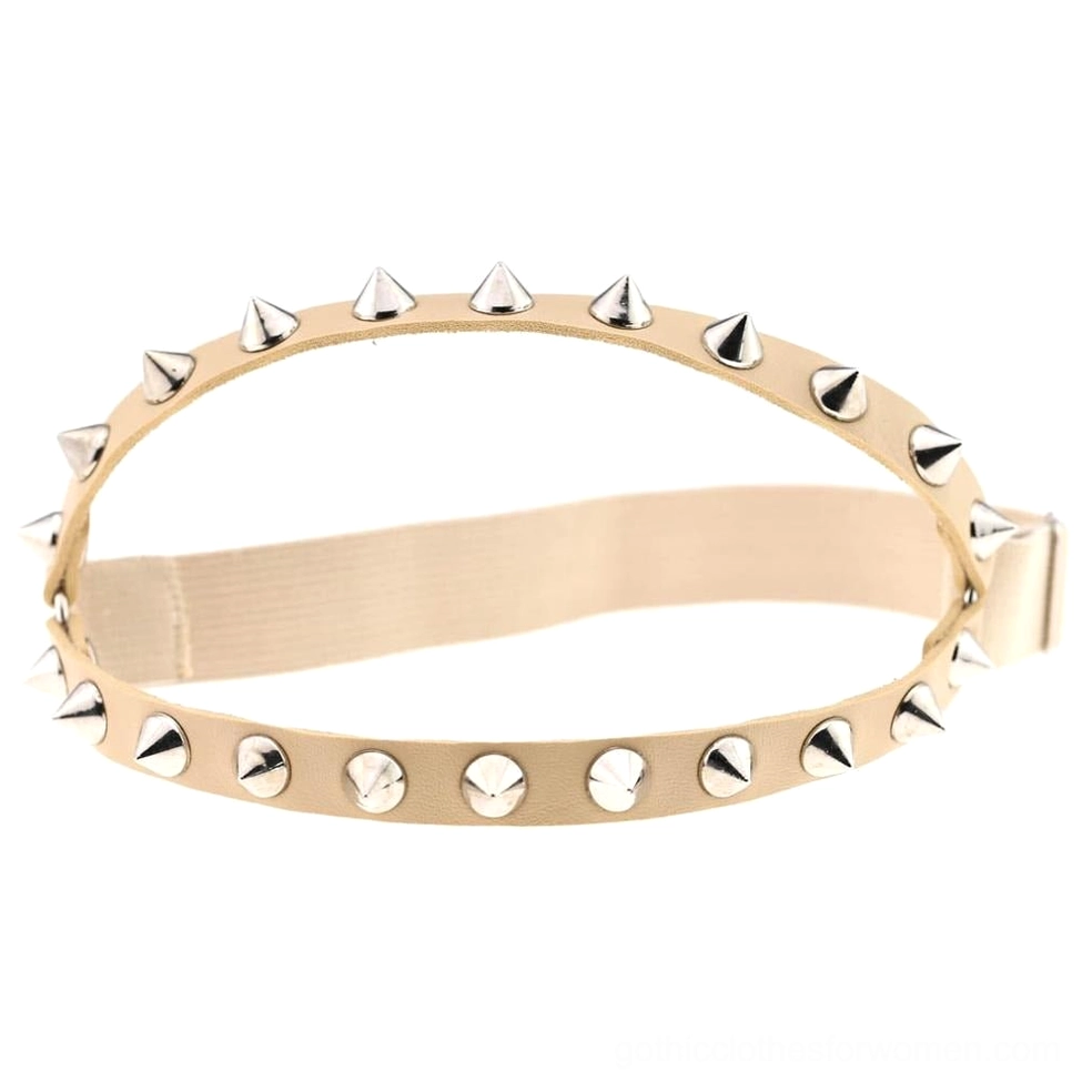 Beige nude colored elastic leather leg garter with silver metal studs cone and round rivets adjustable closure