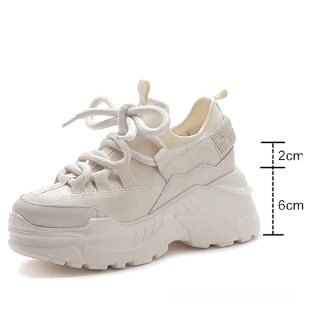 Single beige height-increasing platform sneaker showing marked heel elevation and side profile detail
