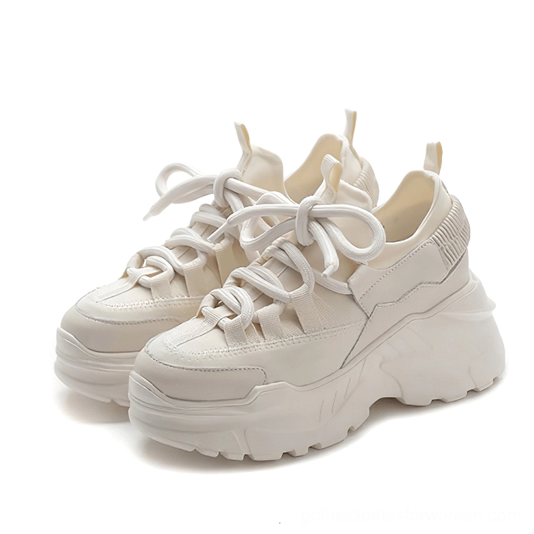 Beige platform sneakers pair with ribbed heel tabs, chunky outsole, and lace-up fastening detail