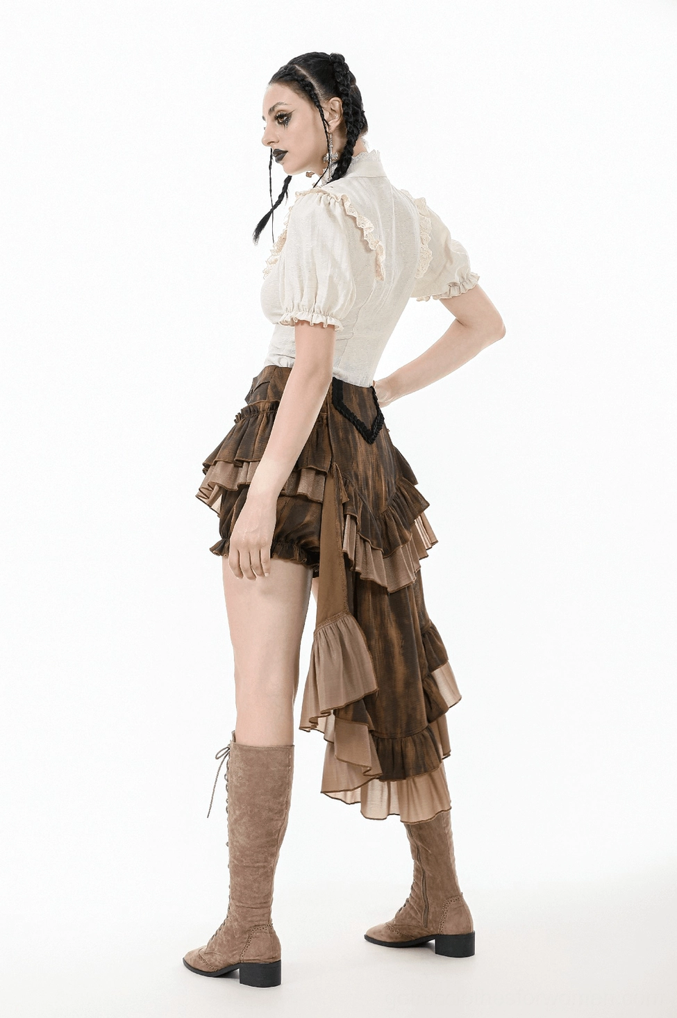 Detailed view of beige puff sleeve blouse emphasizing romantic gothic aesthetic and fine lace craftsmanship