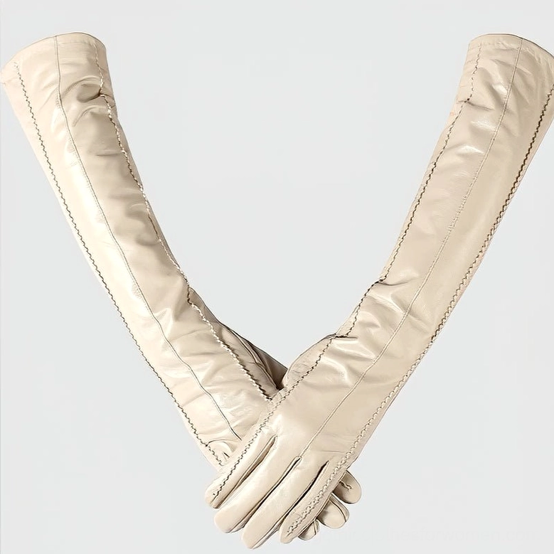 Matching beige sheepskin glove pair, showcasing uniform craftsmanship and coral velvet lining for comfort