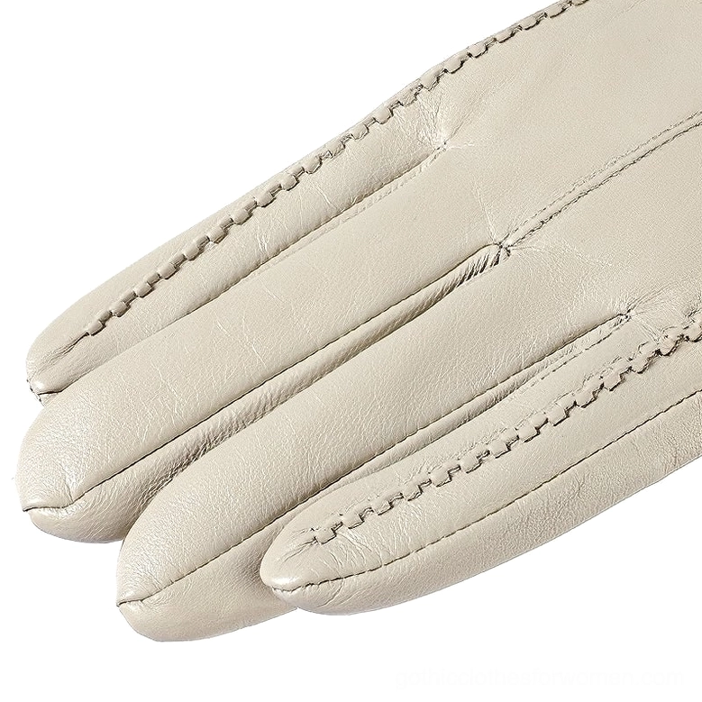 Beige sheepskin gloves close-up view with visible decorative seams and premium leather texture