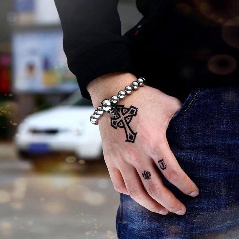 Biker style memento mori bracelet outdoor street wear - dark alternative fashion jewelry on male model