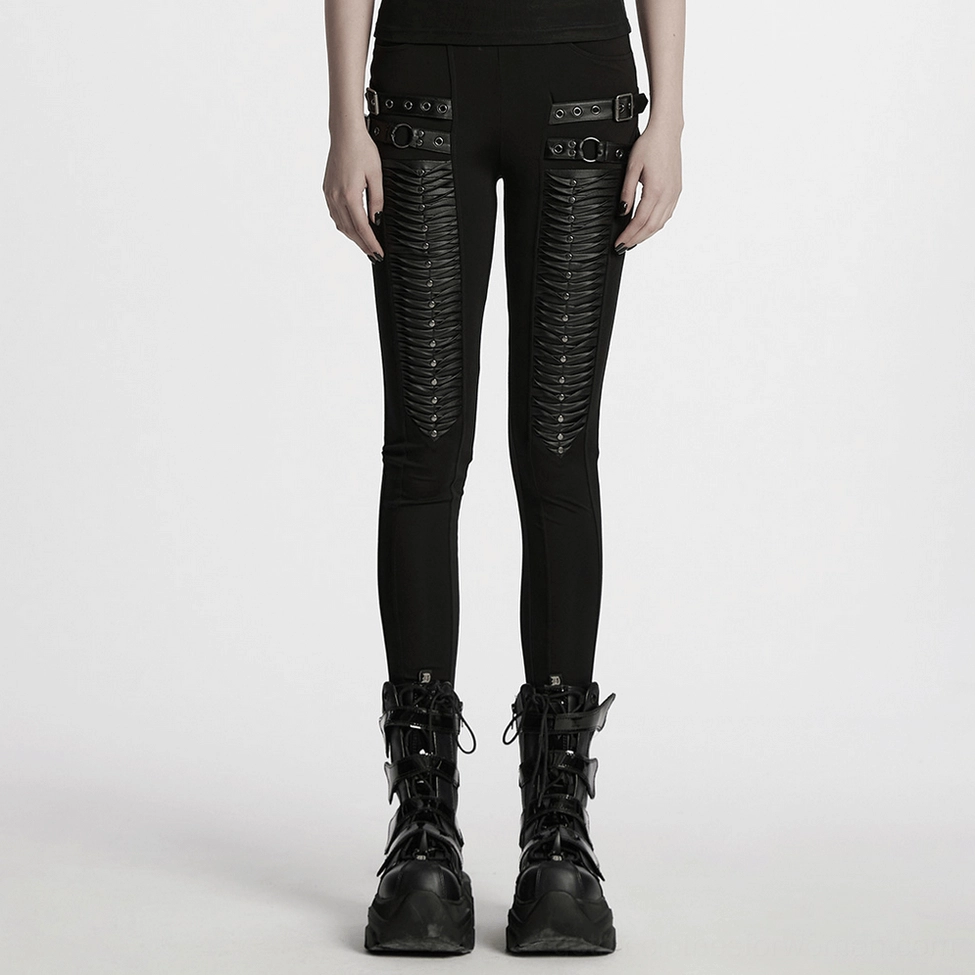 Black gothic leggings side view demonstrating slim fit and architectural pleat design