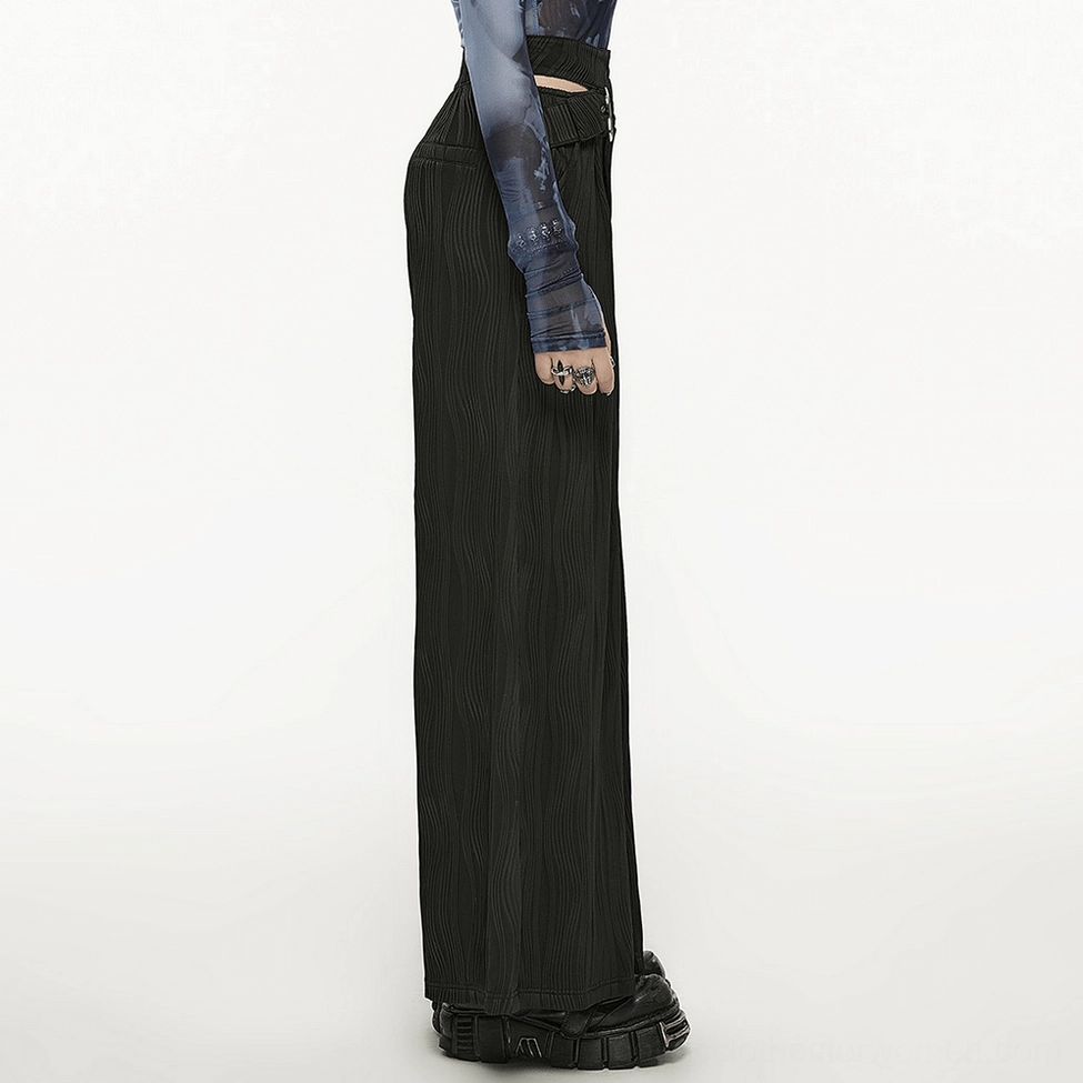 Black gothic wide leg pants front side view - asymmetrical silver buckle detail and wavy knit pattern on full length dark trousers