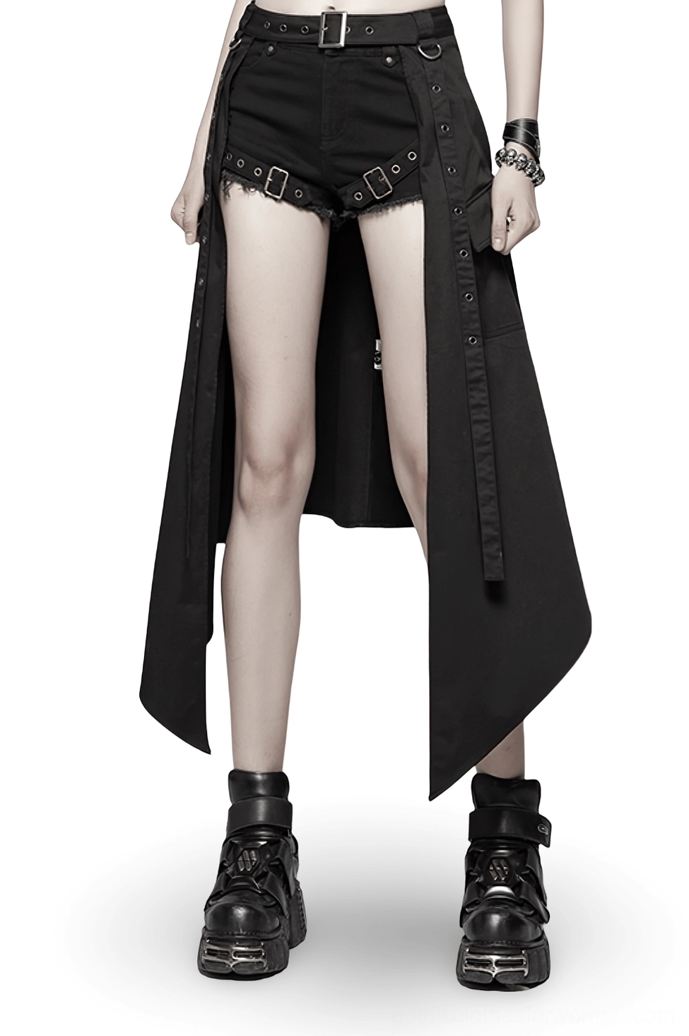 Black asymmetrical cargo mini skirt front view on female model wearing platform boots and denim shorts, showcasing punk gothic alternative fashion style