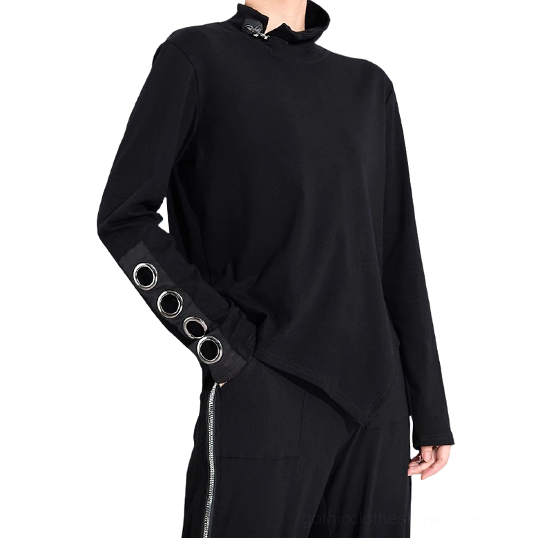Women's black asymmetrical gothic top with stand collar zipper and metal grommet cuffs, three-quarter left side view on model