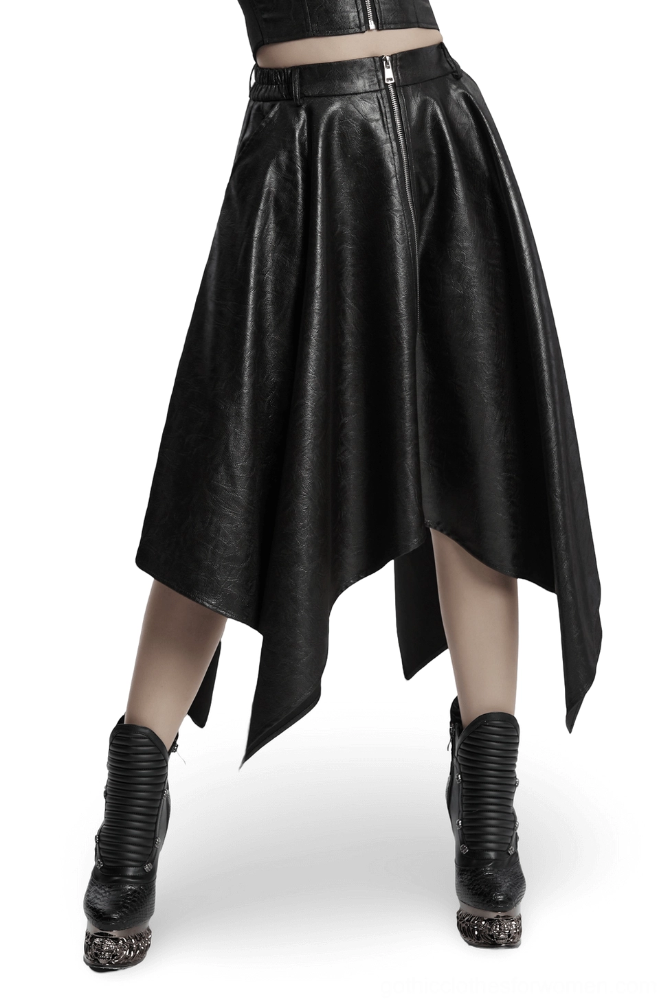 Black asymmetrical faux leather skirt with front metal zipper and handkerchief hem, front low angle view on model