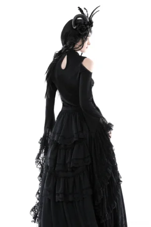 Back view of black lace off-shoulder top showing keyhole closure and layered ruffle skirt detail
