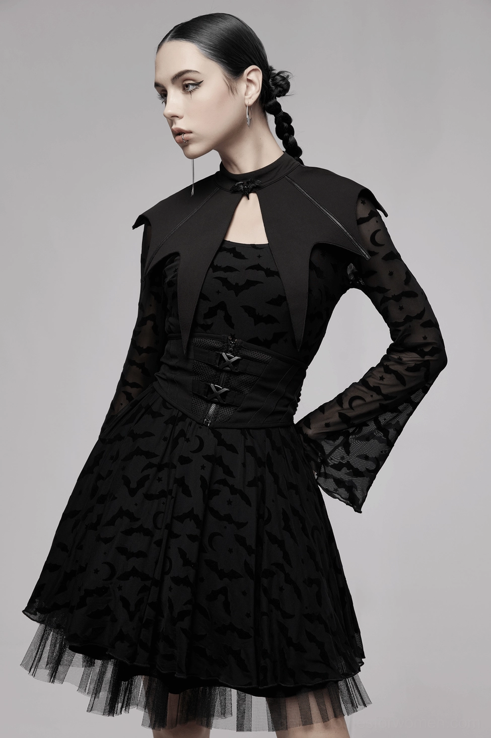 Black bat gothic cape worn with sheer mesh printed dress, three-quarter fashion view
