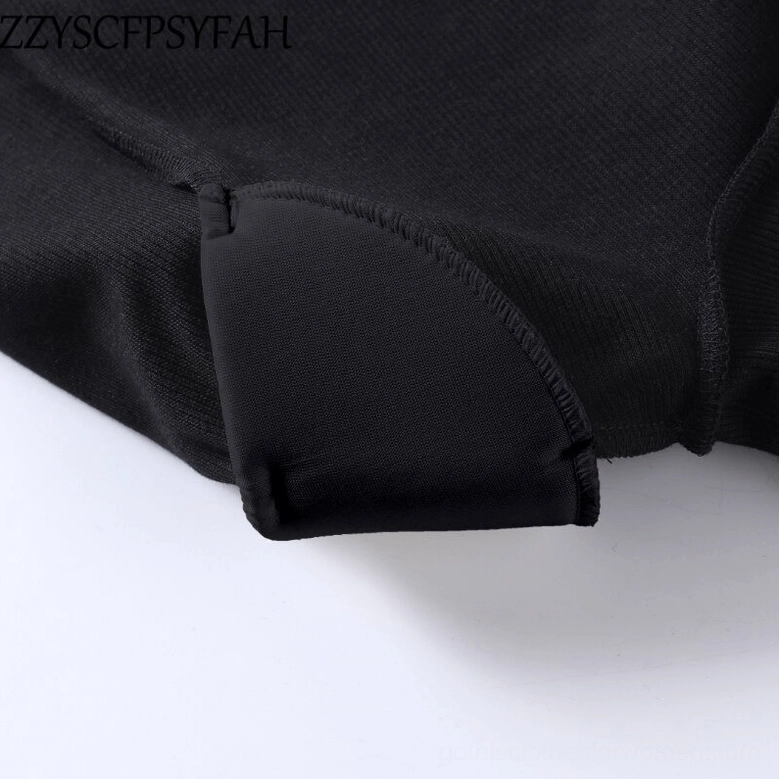 Black bodysuit hem with rolled edge stitching detail close-up