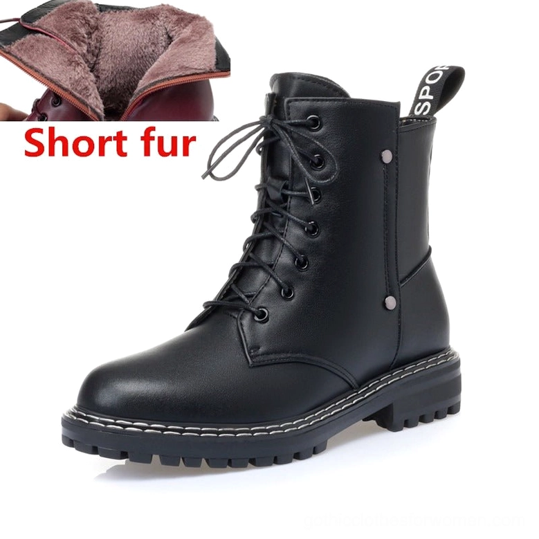 Black combat leather boot frontal three-quarter showing short wool fuzzy lining and thick lug sole