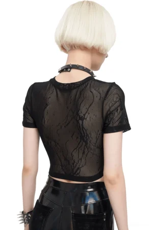 Black gothic crop top rear view showing sheer lace back panel and cropped hemline on model