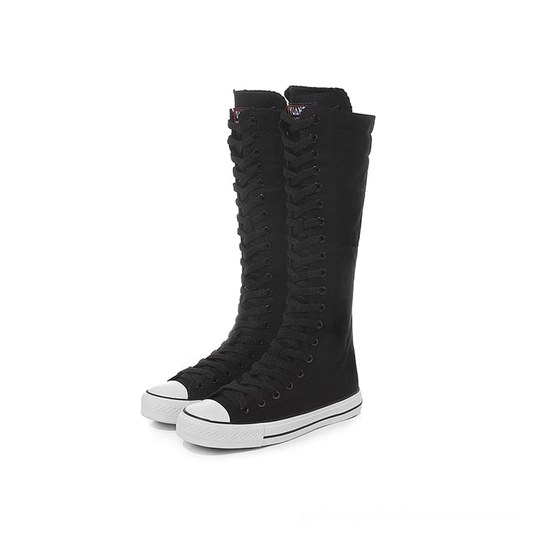 Black knee-high canvas sneaker boots with white rubber trim and lace-up closure