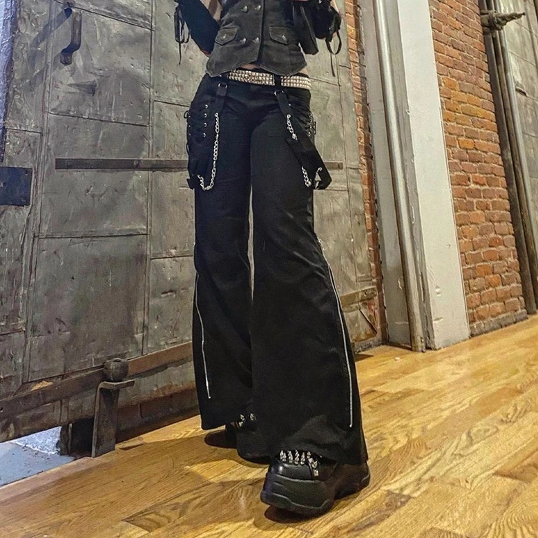 Black cargo pants with side zipper and industrial hardware, showcasing the contemporary gothic aesthetic and alternative fashion style