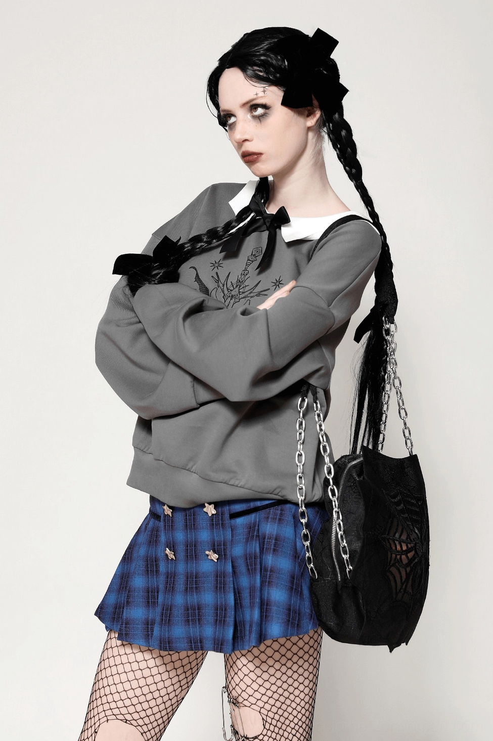 Black cat gothic sweatshirt styling with alternative fashion accessories and dark aesthetic